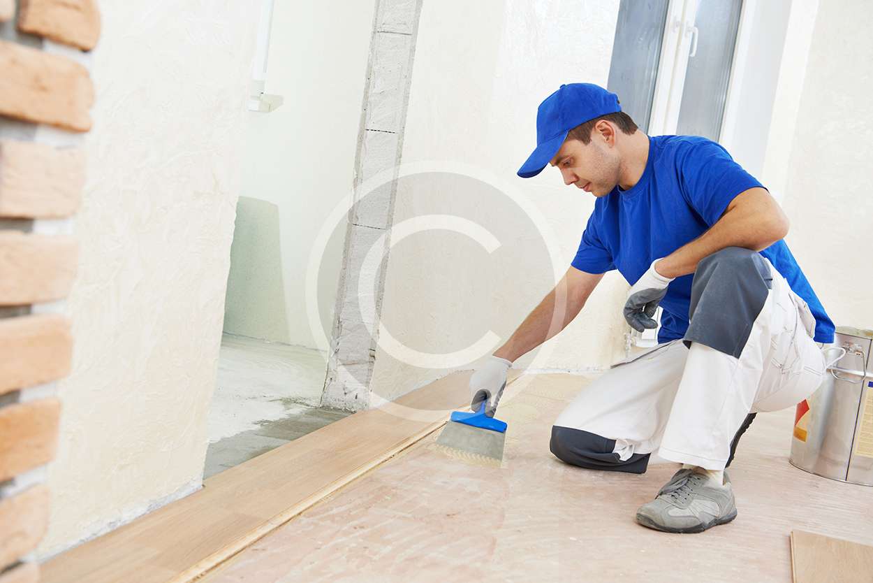 parquet worker adding glue on floor